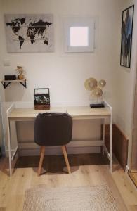 a desk with a chair in a room at Studio Confort Netflix Business in Brétigny-sur-Orge