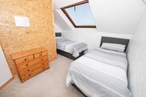 Katil atau katil-katil dalam bilik di The Bungalow at Seaway's, Sleeps 11 +
