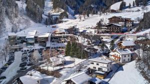 an aerial view of a resort in the snow at Chalet Schmitten 102 by Chalet Alp Lux - Opposite ski lift in Zell am See +24 photos