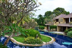 a view of a resort with a swimming pool at Pool Villa Merumatta Senggigi in Senggigi
