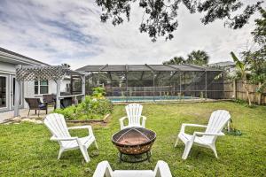 a group of chairs and a grill in a yard at St Augustine Home with Private Pool 4 Mi to Beach! in Saint Augustine