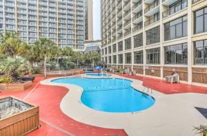 
a large swimming pool in a large building at Beachfront Resort Condo with Lazy River and Pools! in Myrtle Beach
