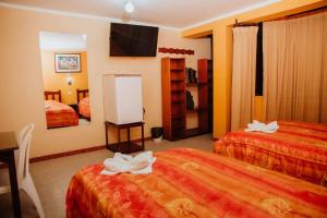 Postel nebo postele na pokoji v ubytování Hotel Amoretto