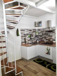 Kuchyňa alebo kuchynka v ubytovaní Baglio Reale Apartments