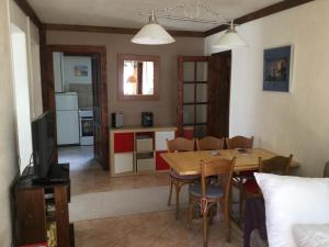 a kitchen and dining room with a table and chairs at Chalet Les Campanules in Chamonix