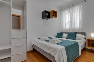 Posteľ alebo postele v izbe v ubytovaní Apartment PINE FINE with FREE PARKING
