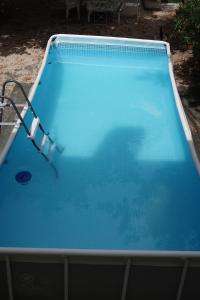 a large blue swimming pool in a yard at Maison avec jardin sur une colline in Marseille