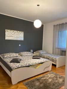 Postel nebo postele na pokoji v ubytování Apartment Viki
