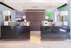 a store with two checkout counters in a store at Holiday Inn & Suites Spring - The Woodlands in Spring