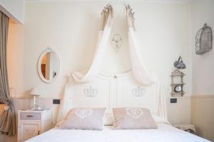A bed or beds in a room at La Casa Di Menny Maison de Campagne