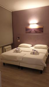 Katil atau katil-katil dalam bilik di Bergamo City - Self Check-in