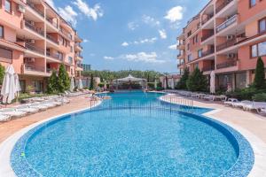 a swimming pool in the middle of a building at Guest Apartments Co Morenia in Sunny Beach