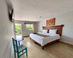 Cama ou camas em um quarto em Blue Coconut Cancun Hotel