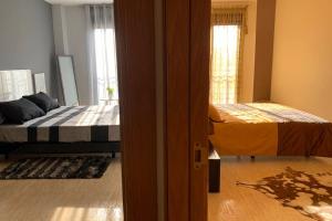 Postel nebo postele na pokoji v ubytování Apartamento Miramar . Amplitud y Comodidad