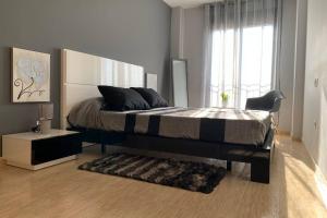 Postel nebo postele na pokoji v ubytování Apartamento Miramar . Amplitud y Comodidad