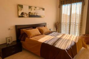 Postel nebo postele na pokoji v ubytování Apartamento Miramar . Amplitud y Comodidad