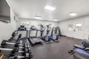 a gym with treadmills and cardio machines at Sunny Cozy Condo in St. George