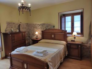 Cama o camas de una habitación en Alojamiento Rural URGAIN I y II