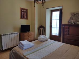 Cama o camas de una habitación en Alojamiento Rural URGAIN I y II