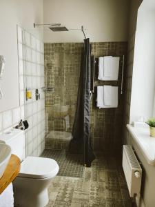 Ett badrum på Hotel Benevilla