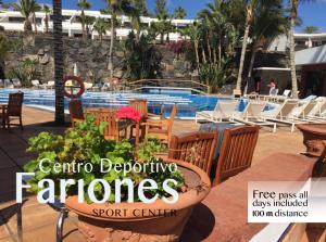 a magazine cover of a patio with a pool at Luxury Diving Apartment in Puerto del Carmen
