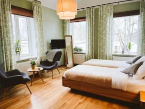 Un pat sau paturi într-o cameră la Hotel Benevilla