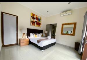 מיטה או מיטות בחדר ב-Villa Akmali Seminyak - 3 Bedrooms