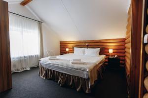 Кровать или кровати в номере Отель «Байкальские Сезоны»
