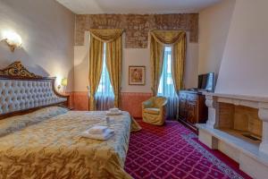 Postel nebo postele na pokoji v ubytování Alexios Luxury Hotel