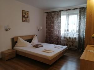 Postel nebo postele na pokoji v ubytování Hotel Dacor