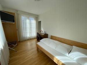 Voodi või voodid majutusasutuse Hotel Rössli toas