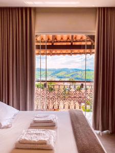 Ένα ή περισσότερα κρεβάτια σε δωμάτιο στο Pousada Buena Vista