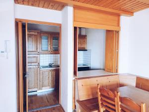 Kuchyň nebo kuchyňský kout v ubytování Pohorje Village Wellbeing Resort - Forest Apartments Videc + 37 fotografií