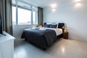 Postel nebo postele na pokoji v ubytování Houthavens Apartments