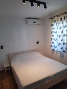 Postel nebo postele na pokoji v ubytování Manda Ljubetić