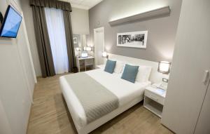 Posteľ alebo postele v izbe v ubytovaní Nuovo Albergo Centro