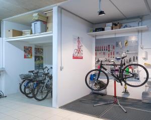 a room with several bikes parked on a wall at Hotel la Meridiana, Lake & SPA in Ascona