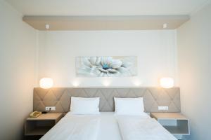 Łóżko lub łóżka w pokoju w obiekcie Hotel-Restaurant Gollner