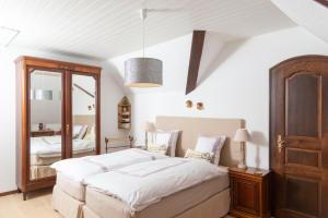 Postelja oz. postelje v sobi nastanitve B&B L'Eden