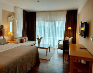 Кровать или кровати в номере Cocos The Club Solto