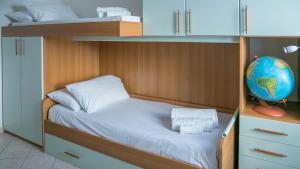 Ένα ή περισσότερα κρεβάτια σε δωμάτιο στο Welcomely - Oasi in centro - Cala Gonone