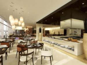 En restaurang eller annat matställe på Hyatt Place Dubai Al Rigga Residences