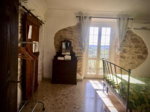 a bedroom with a bed and a large window at B&B Il Secolo Breve in Ortona