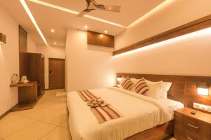 Voodi või voodid majutusasutuse Trivers Resort Munnar toas