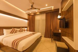 Voodi või voodid majutusasutuse Trivers Resort Munnar toas