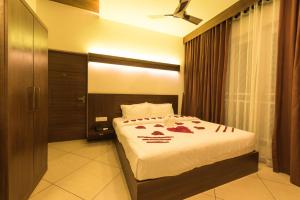 Voodi või voodid majutusasutuse Trivers Resort Munnar toas