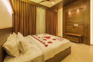 Voodi või voodid majutusasutuse Trivers Resort Munnar toas