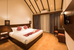 Postel nebo postele na pokoji v ubytování Trivers Resort Munnar + 37 fotografií
