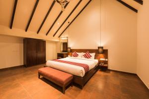 Voodi või voodid majutusasutuse Trivers Resort Munnar toas