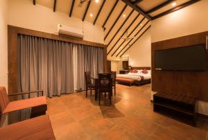 Voodi või voodid majutusasutuse Trivers Resort Munnar toas